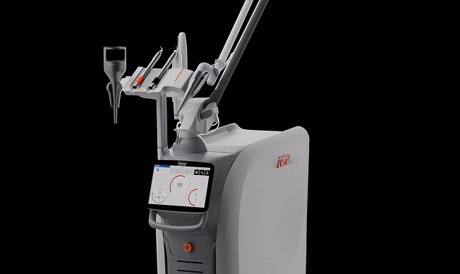 A sleek medical laser device with a display screen and adjustable arm against a black background, conveying modernity and precision in technology.
